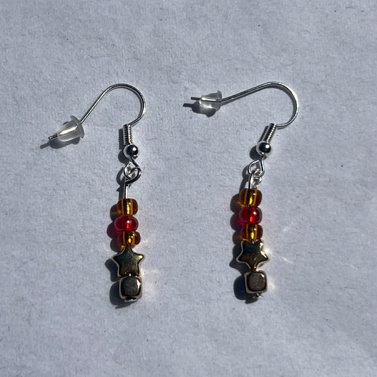 silver earnings with red, gold, and orange beads