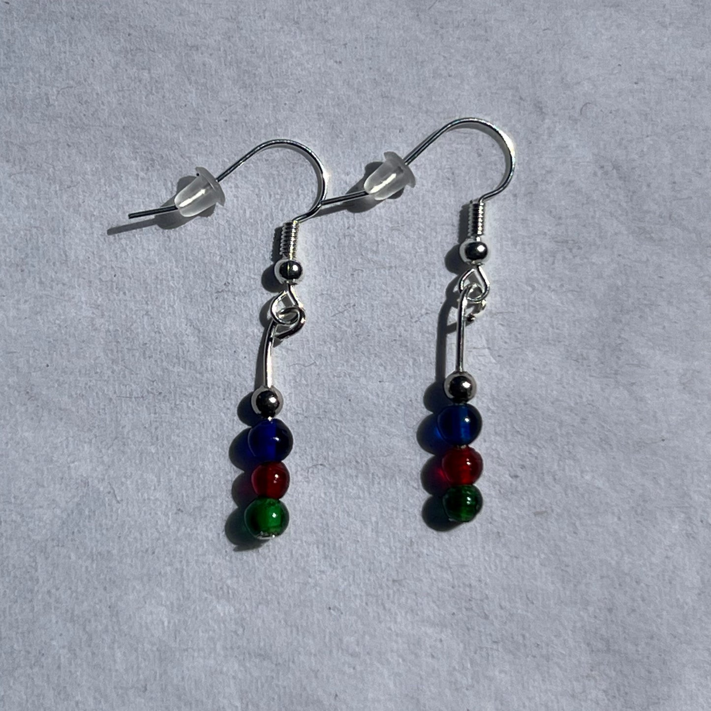 silver earrings with silver, red, blue, and green beads