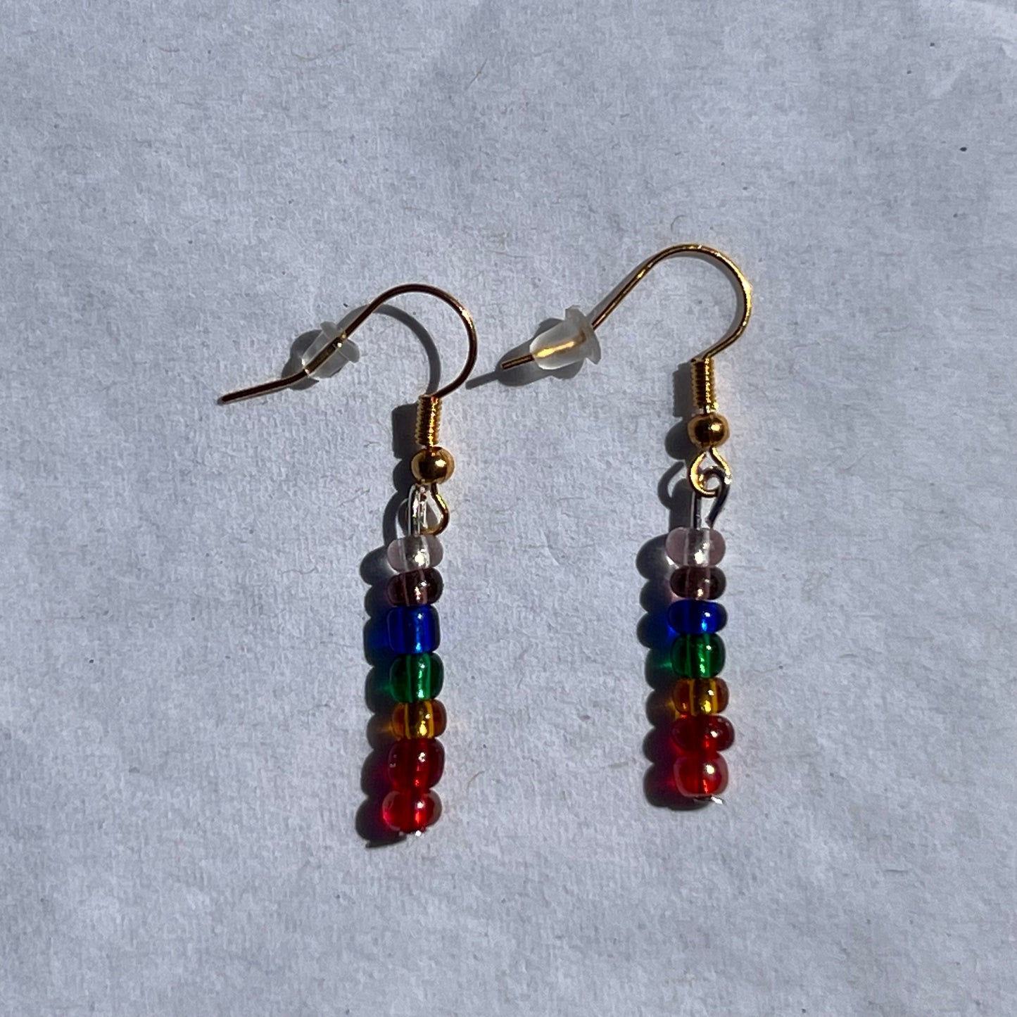 gold earrings with striped beads