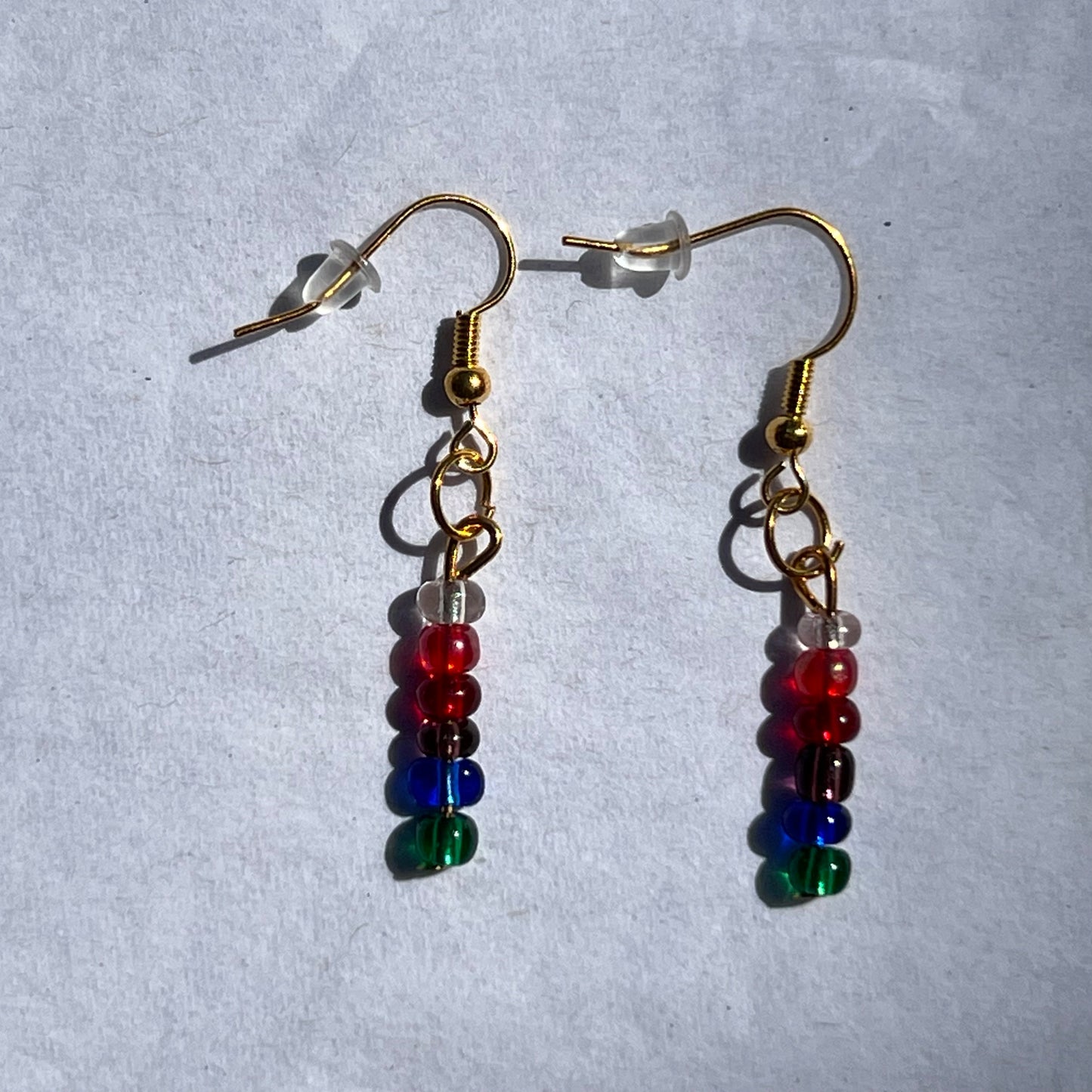 gold earrings with striped beads