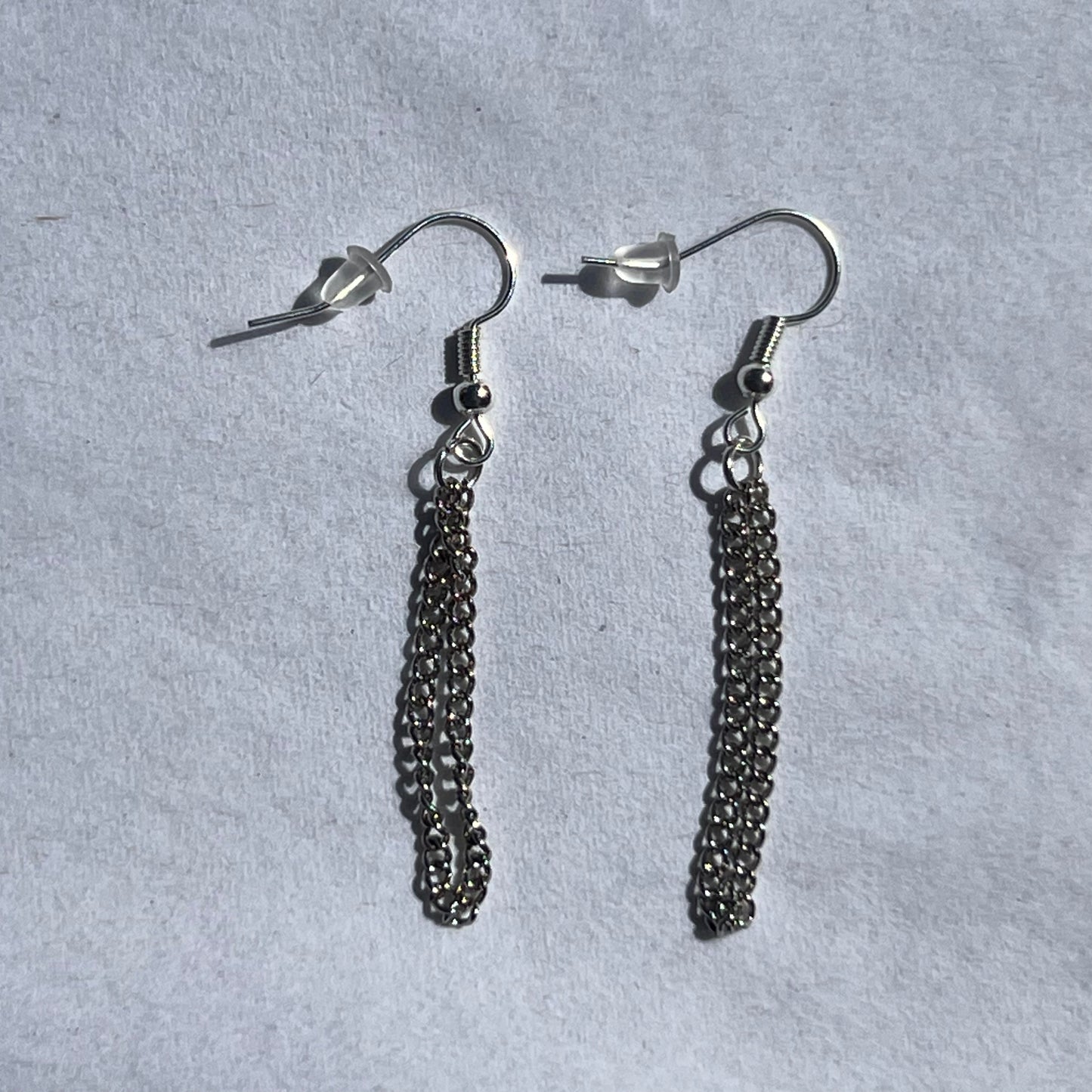 silver earrings with chain.